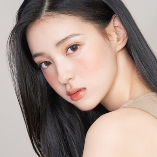 Asian model demonstrating a K-idol-inspired look with 1-Day Brown coloured contact lenses, highlighting the instant brightening and enlarging effect of the circle contact lenses over dark irises.