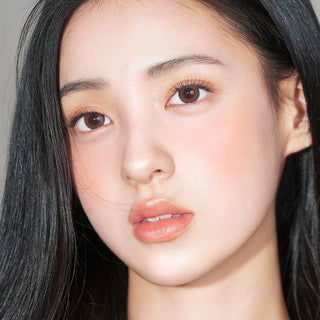 Asian model demonstrating a K-idol-inspired look with 1-Day Brown coloured contact lenses, highlighting the instant brightening and enlarging effect of the circle contact lenses over dark irises.