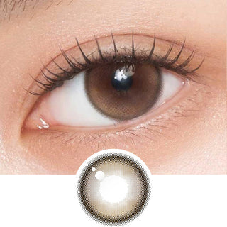 Close-up shot of model's eye adorned with Gemhour Demeter 1-Day Amber Brown (10pk) daily color contact lenses with prescription, complemented by clean eye makeup, showing the brightening and enlarging effect of the circle contact lens on dark brown eyes, above a cutout of the contact lens pattern with limbal ring on a white background.