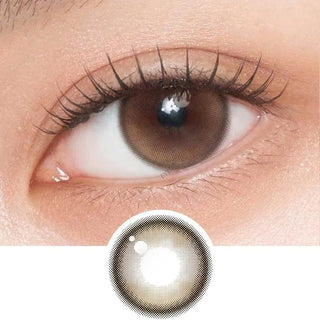 Close-up shot of model's eye adorned with Gemhour Demeter 1-Day Amber Brown (10pk) daily color contact lenses with prescription, complemented by clean eye makeup, showing the brightening and enlarging effect of the circle contact lens on dark brown eyes, above a cutout of the contact lens pattern with limbal ring on a white background.