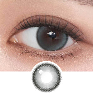 Close-up shot of model's eye adorned with Gemhour Demeter 1-Day Ocean Blue (10pk) daily color contact lenses with prescription, complemented by clean eye makeup, showing the brightening and enlarging effect of the circle contact lens on dark brown eyes, above a cutout of the contact lens pattern with limbal ring on a white background.