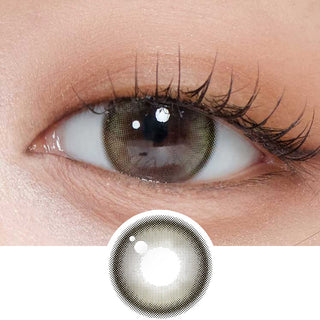 Close-up shot of model's eye adorned with Gemhour Demeter 1-Day Olive Green (10pk) daily color contact lenses with prescription, complemented by clean eye makeup, showing the brightening and enlarging effect of the circle contact lens on dark brown eyes, above a cutout of the contact lens pattern with limbal ring on a white background.