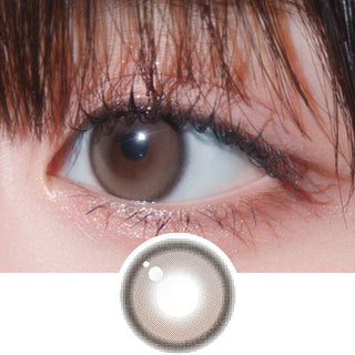 Close-up shot of model's eye adorned with Gemhour Hecate 1-Day Sand Brown (10pk) daily color contact lenses with prescription, complemented by clean eye makeup, showing the brightening and enlarging effect of the circle contact lens on dark brown eyes, above a cutout of the contact lens pattern with limbal ring on a white background.