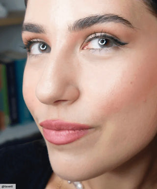 Model wearing Glossy Ivory colored contacts, showing the natural yet transformative effect on naturally dark eyes.