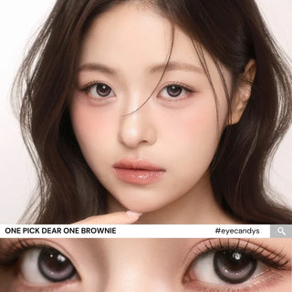 Close-up of model’s eyes wearing i-Girl One Pick Dear One Brownie contact lenses from EyeCandys, showing warm brown iris color, realistic highlights, weighted non-rotating design, and subtle eye-widening effect