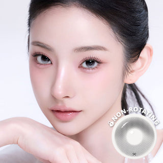 Model wearing reborn gray contact lenses with lens sample below with pink light makeup.