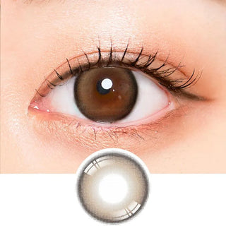 Macro shot of an eye wearing the i-Sha Oriana Mune 1-Day Brown (10pk) prescription colour contact lens, showing the multi-colored detail and natural effect on dark brown eyes, with clean eye makeup. At the bottom is the pattern of the colored lens design, showing the dotted detail and pigmentation.