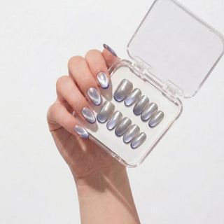 Close up hand showcasing EyeCandys Lavendroid press on nails with silvery chrome base and holographic colour shifting finish.