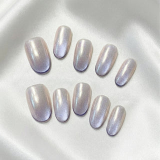 EyeCandys Lavendroid press on nails featuring silvery chrome cat eye nails with cobalt violet gradient and aurora shimmer finish.