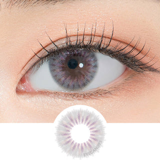 Close-up shot of a model's eye wearing Lensrang Ailleen Grey color contacts with prescription, paired with K-beauty-inspired eye makeup, showing the brightening and enlarging effect of the circle contact lens on dark brown eyes, above a cutout of the contact lens pattern with limbal ring on a white background.