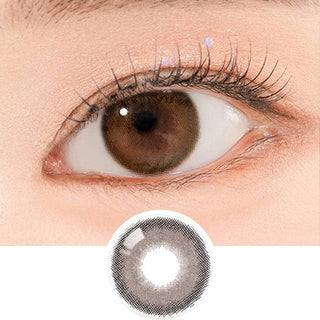 Close-up shot of a model's eye wearing Lensrang Comely Choco color contacts with prescription, paired with K-beauty-inspired eye makeup, showing the brightening and enlarging effect of the circle contact lens on dark brown eyes, above a cutout of the contact lens pattern with limbal ring on a white background.