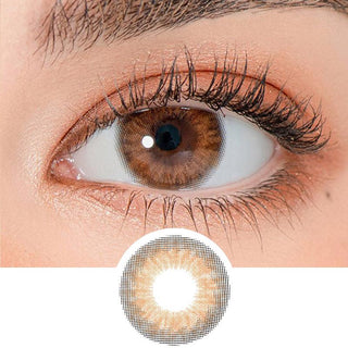 Close-up shot of a model's eye wearing Lensrang Iwwinka Brown color contacts with prescription, paired with K-beauty-inspired eye makeup, showing the brightening and enlarging effect of the circle contact lens on dark brown eyes, above a cutout of the contact lens pattern with limbal ring on a white background.