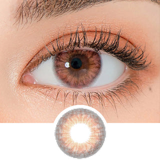 Close-up shot of a model's eye wearing Lensrang Iwwinka Pink Brown color contacts with prescription, paired with K-beauty-inspired eye makeup, showing the brightening and enlarging effect of the circle contact lens on dark brown eyes, above a cutout of the contact lens pattern with limbal ring on a white background.
