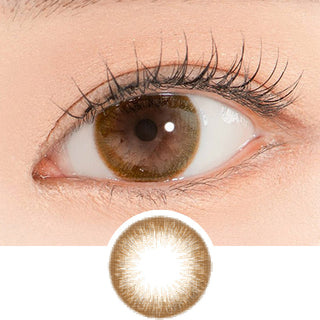 Close-up shot of a model's eye wearing Lensrang Iwwiny Brown color contacts with prescription, paired with K-beauty-inspired eye makeup, showing the brightening and enlarging effect of the circle contact lens on dark brown eyes, above a cutout of the contact lens pattern with limbal ring on a white background.