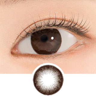 Close-up shot of a model's eye wearing Lensrang Iwwiny Choco color contacts with prescription, paired with K-beauty-inspired eye makeup, showing the brightening and enlarging effect of the circle contact lens on dark brown eyes, above a cutout of the contact lens pattern with limbal ring on a white background.