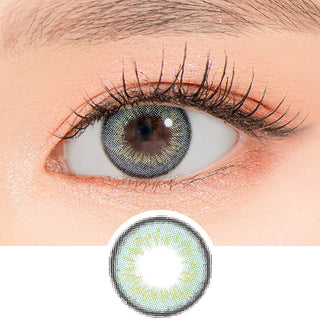 Close-up shot of a model's eye wearing Lensrang Iwwitch Ocean Blue color contacts with prescription, paired with K-beauty-inspired eye makeup, showing the brightening and enlarging effect of the circle contact lens on dark brown eyes, above a cutout of the contact lens pattern with limbal ring on a white background.