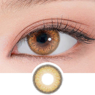 Close-up shot of a model's eye wearing Lensrang Madeye Brown color contacts with prescription, paired with K-beauty-inspired eye makeup, showing the brightening and enlarging effect of the circle contact lens on dark brown eyes, above a cutout of the contact lens pattern with limbal ring on a white background.