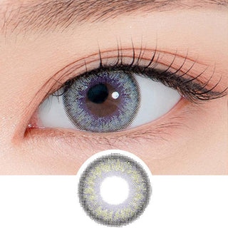 Close-up shot of a model's eye wearing Lensrang Madeye Grey color contacts with prescription, paired with K-beauty-inspired eye makeup, showing the brightening and enlarging effect of the circle contact lens on dark brown eyes, above a cutout of the contact lens pattern with limbal ring on a white background.