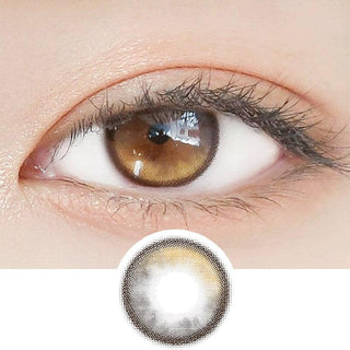 Close-up shot of a model's eye wearing Lensrang Planet Space Brown color contacts with prescription, paired with K-beauty-inspired eye makeup, showing the brightening and enlarging effect of the circle contact lens on dark brown eyes, above a cutout of the contact lens pattern with limbal ring on a white background.