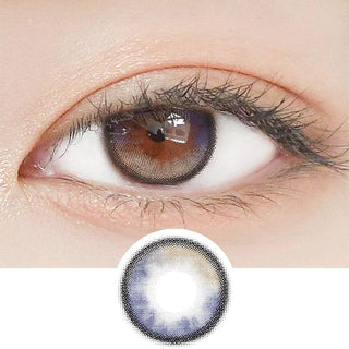 Close-up shot of a model's eye wearing Lensrang Planet Space Grey color contacts with prescription, paired with K-beauty-inspired eye makeup, showing the brightening and enlarging effect of the circle contact lens on dark brown eyes, above a cutout of the contact lens pattern with limbal ring on a white background.