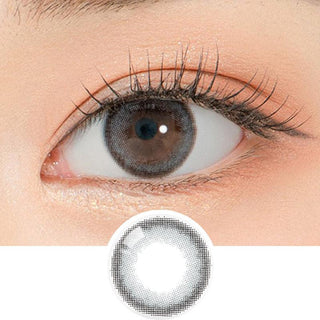 Close-up shot of a model's eye wearing Lensrang School Ring Grey color contacts with prescription, paired with K-beauty-inspired eye makeup, showing the brightening and enlarging effect of the circle contact lens on dark brown eyes, above a cutout of the contact lens pattern with limbal ring on a white background.