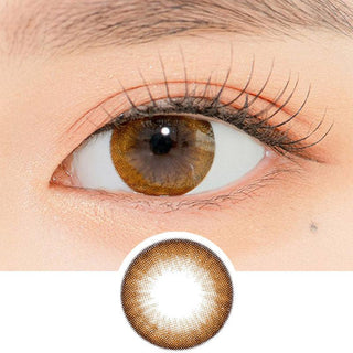 Close-up shot of a model's eye wearing Lensrang Snug Brown color contacts with prescription, paired with K-beauty-inspired eye makeup, showing the brightening and enlarging effect of the circle contact lens on dark brown eyes, above a cutout of the contact lens pattern with limbal ring on a white background.