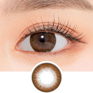 Close-up shot of a model's eye wearing Lensrang Snug Choco color contacts with prescription, paired with K-beauty-inspired eye makeup, showing the brightening and enlarging effect of the circle contact lens on dark brown eyes, above a cutout of the contact lens pattern with limbal ring on a white background.