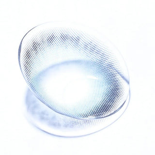 Macro shot of EyeCandys Olola Meow Koshort Green colored contact lens, showcasing intricate lens pattern and vibrant green color.