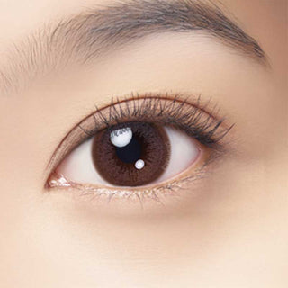 Close-up of eye wearing EyeCandys Marsala Pink colored contact lens – soft pink tone with a natural, enhanced look. Available in prescription strength for colored contact lenses.