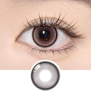 Olala Meow Angora Pink color contact lens on top of a dark eye paired with subtle eye makeup and curled wispy eyelashes, above the contact lens design.