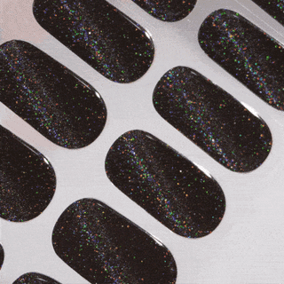 EyeCandys gel nail stickers displayed on film, showcasing vibrant, long-lasting designs for easy at-home manicures. Perfect for effortless, salon-quality nails with durable wear and a glossy finish