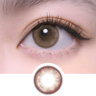 Close-up of one eye wearing EyeCandys Merry Mocha colored contact lens – prescription color contact lenses that enhance natural eyes with long lashes and feathery brows. Lens design shown below.