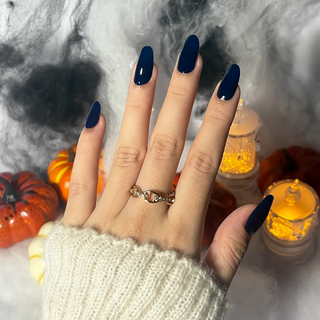 Hand showcasing EyeCandys Midnight Magic Gel Nail Sticker – rich ink-blue nails with salon-quality shine. Versatile DIY gel manicure for elegant, moody, and polished nail looks. Long-lasting, non-toxic, and vegan-friendly.