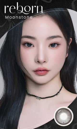 A female model with natural dark eyes wearing i-Sha Reborn Moon Stone contact lenses,