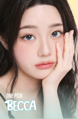 Model with long lashes showcasing EyeCandys One Pick Becca Prescription Contact Lenses – realistic, comfortable, and beautifully blended eye color