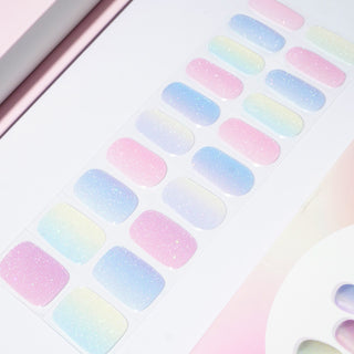 EyeCandys gel nail stickers displayed on film, showcasing vibrant, long-lasting designs for easy at-home manicures. Perfect for effortless, salon-quality nails with durable wear and a glossy finish