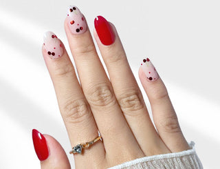Hand wearing EyeCandys Petite Cherry Gel Nail Stickers – glossy, long-lasting, easy-to-apply nail wraps for a salon-quality manicure at home