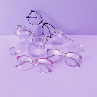 Infinity oversized prescription eyeglasses, available in blue light blocking lenses and in readers with magnification, from EyeCandys, filmed on a purple background