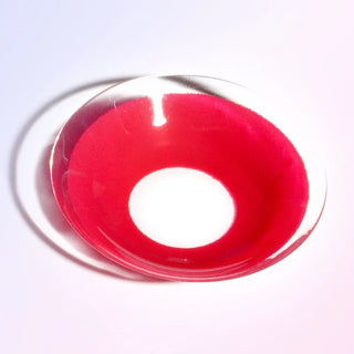 Macro shot of the EyeCandys red cosplay prescription colored contact lens on a white background, highlighting the intricate details and pattern of the lens design.