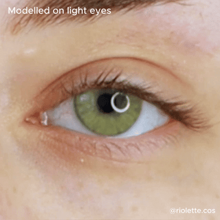 close up eye wearing Dare to be Hazel contact lenses on top of a light color iris.