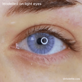 Close up eye wearing Eyecandys shade violet in light color iris.