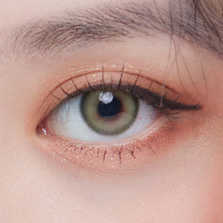 Close up of Sage Green Color Contact Lens for Dark Eyes, with minimal eye makeup, showing the iridescent color of the lens design on dark brown eyes.