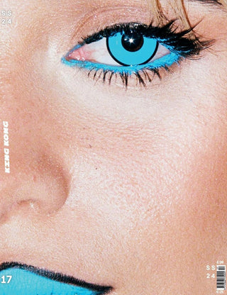 Electric blue color contact lenses worn on a female model (Camila Cabello) with dark eyes, photographed in strong light, showing the opacity of the anime contact lens.