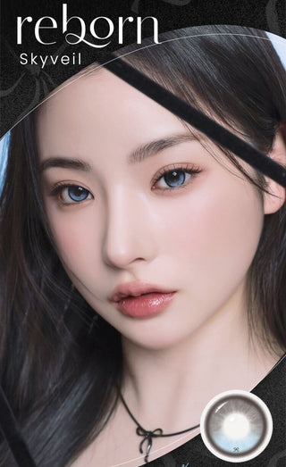 A female model with natural dark eyes wearing i-Sha Reborn Reborn Sky Veil contact lenses,