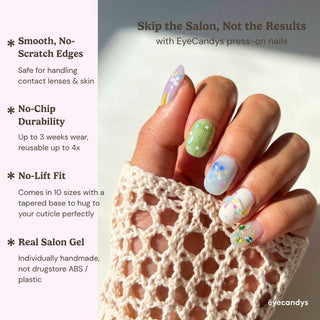Close up hand showcasing EyeCandys Sprinkle Season press on nails featuring pastel jelly nails, star confetti, and crystal embellishments.