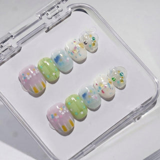 EyeCandys Sprinkle Season press on nails featuring lavender jelly nails with star confetti, sage plaid nail, and milky white sprinkle nails with rhinestones.