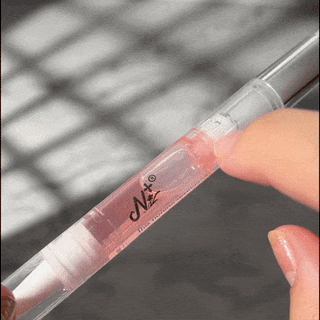 Step nine of removing EyeCandys Gel Nail Stickers: applying oil to gently remove the stickers, ensuring safe removal and maintaining healthy nails for future gel manicures