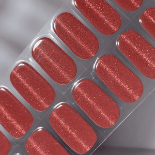 EyeCandys Strawberry and Spice Gel nail sticker featuring a rich berry-red hue with fine golden shimmer. This semi-cured gel set brings a warm, festive flair to your manicure—perfect for cozy seasons, bold looks, or holiday glam with easy, long-lasting wear.