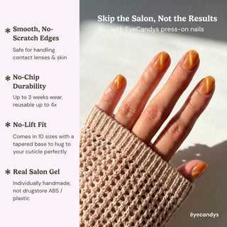 Hand displaying EyeCandys Sun Drops Press-On Nails with reusable salon gel copper nails and golden micro-shimmer finish.