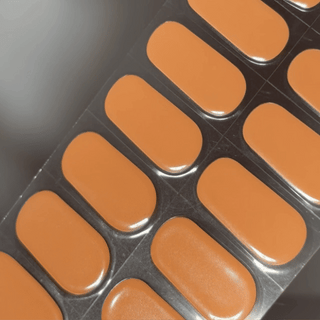 EyeCandys Tangerine Cream Gel nail sticker featuring a smooth, creamy orange shade with a soft matte-gloss finish. This semi-cured gel set brings a fresh, juicy pop of color—perfect for summer moods, minimalist styles, and long-lasting everyday wear.